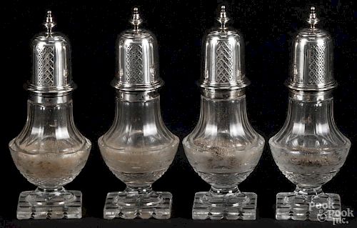 Set of four sterling silver and cut glass casters, early 20th c., the glass etched with stags