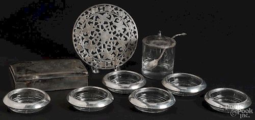Set of six sterling silver mounted coasters, together with a hot plate, a mustard jar with a spoon