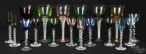 Eighteen pieces of colored glass rope twist stemware.