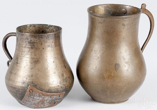 Two bronze drinking vessels, 18th/19th c., 5 1/2'' h. and 6 3/4'' h. Provenance: DeHoogh Gallery
