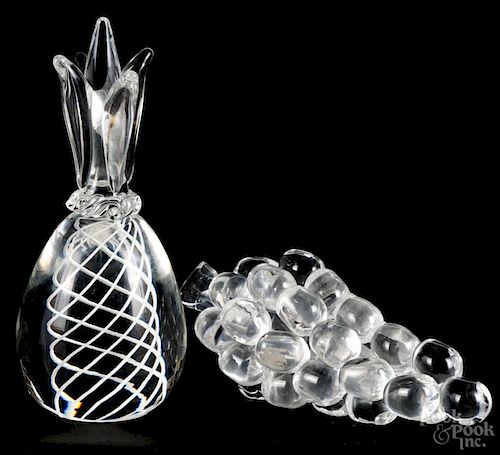 Steuben glass pineapple, 7 1/4'' h., and a Steuben grape bunch, 7'' h., signed on base and stem.