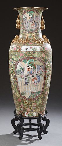 Large Oriental Famille Rose Baluster Palace Vase, 20th c., the sides with gilt Foo dog handles above panel decorations of figures ov...