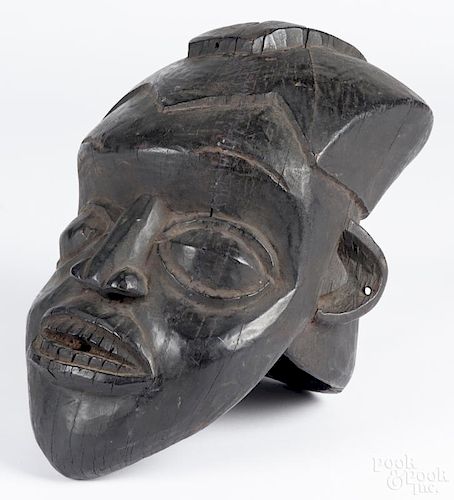 Carved African tribal mask, 15'' h. Provenance: DeHoogh Gallery, Philadelphia.