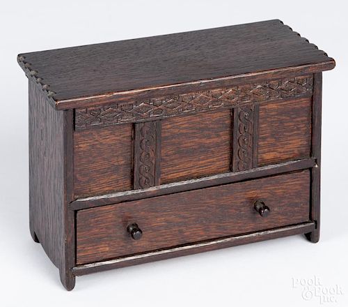 Miniature English oak blanket chest, by English Village Craftworks, 4 3/4'' h., 6 3/4'' w.