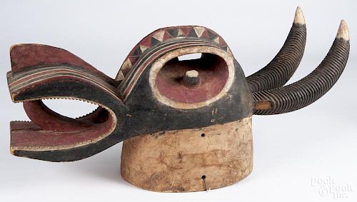 African carved and polychrome painted antelope mask, likely Ivory Coast, 14 1/2'' h., 28'' l.