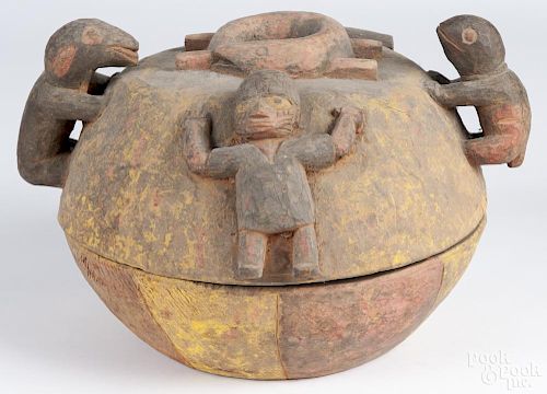 African carved and polychrome painted ceremonial divination bowl of the Yoruba people, 10'' h.