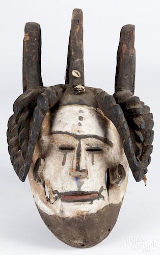 Nigerian Igbo (Ibo) carved and polychrome painted helmet mask, agbogho mmwo
