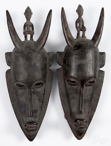 Pair of West African carved n'tomo dance masks of the Bambara (Bamana) people, 19'' h.