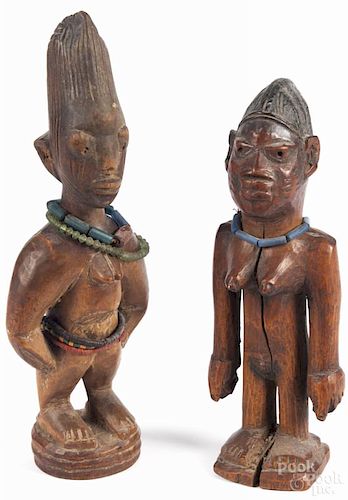 Two African carved ewe ibesi figures of the Yoruba people, with beaded accents, 12'' h.