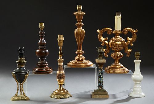 Group of Seven French Lamps, 20th c., consisting of two carved giltwood examples; one alabaster example; one brass example; one cloi...