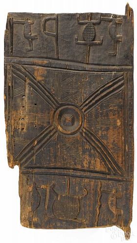 African Senufo tribe carved wooden granary door panel with geometric and animal designs, 47'' h.