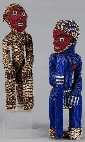 Cameroon grasslands ancestor figures, Bamileke people, with bead and cowrie shell decoration, 23'' h.