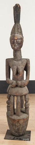 Yoruba carved house post, 60'' h. Provenance: DeHoogh Gallery, Philadelphia.