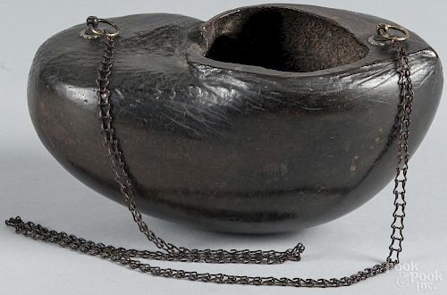 Coco de mer begging bowl or Kashkul, used by traveling Sufi dervishes, 5 1/2'' h., 11'' w.