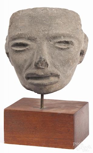 Pre-Columbian carved stone mask, possibly of Aztec origin, 5'' h. Provenance: DeHoogh Gallery