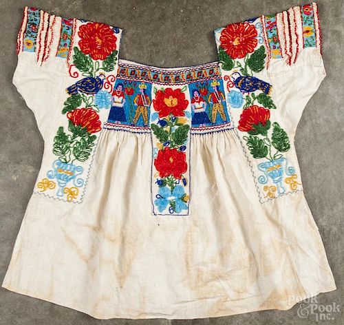 Heavily beaded Mexican cotton blouse, 20th c., decorated with male and female figures