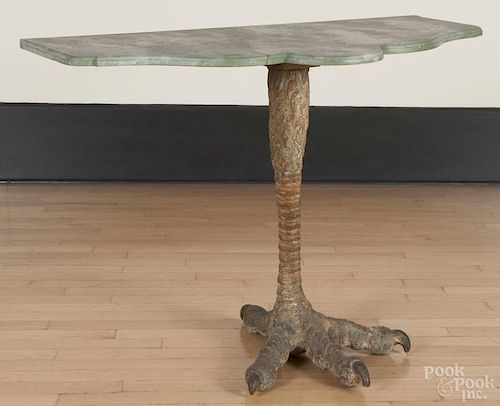 Carved and painted pine pier table, mid 20th c., with a faux marble top and bird leg support, 30'' h.