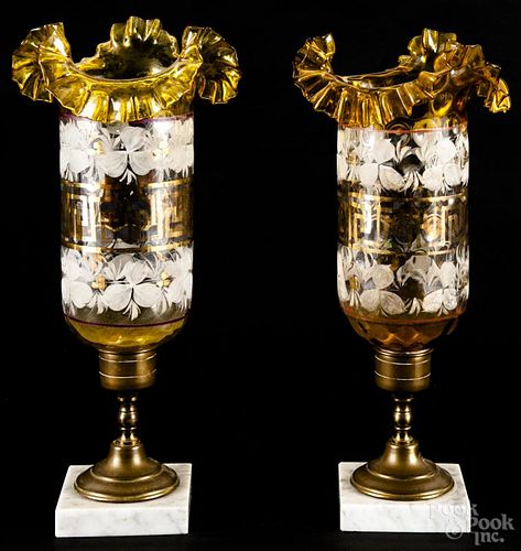 Pair of English candlesticks, late 19th, with amber flash shades and brass and marble bases, 15'' h.
