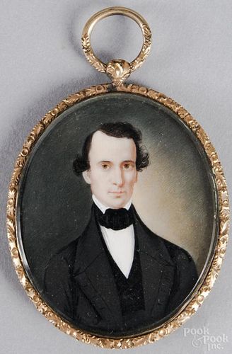 English watercolor on ivory miniature portrait of a gentleman, mid 19th c., housed in a gold locket