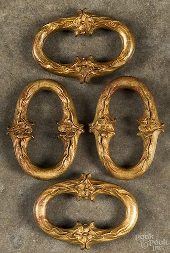 Set of four French gilt bronze bell pull weights, late 19th c., 3 5/8'' h., 5'' w.