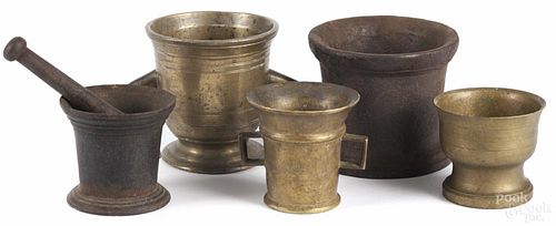 Three brass mortars, 18th c., together with two iron mortars and a pestle, tallest - 6''.