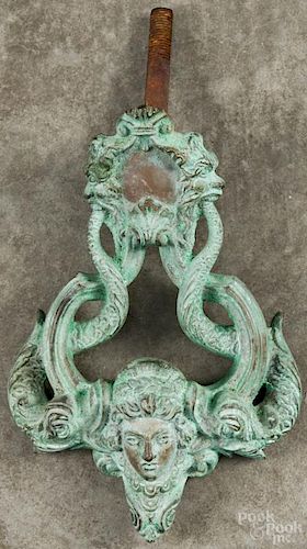 Bronze door knocker, late 19th c., with sea serpents and a female mask, 9'' h.