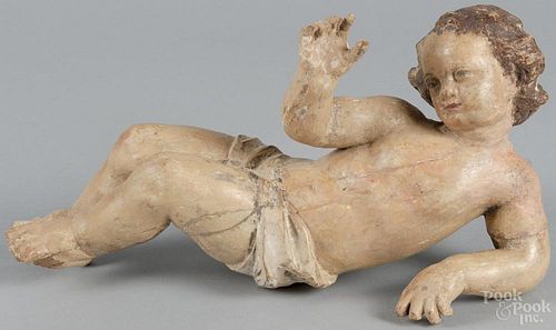 Continental carved and painted cherub, 18th/19th c., 15'' l. Provenance: DeHoogh Gallery, Philadelphia