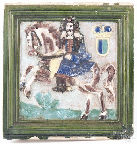 German pottery tile, early 20th c., with a figure on horseback, 10 1/4'' x 9 3/4''.