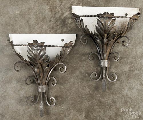 Set of four white metal wall sconces, early 20th c., 13'' h., 10 3/4'' w. Provenance: DeHoogh Gallery