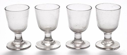 Set of four blown colorless glass cordials, early 19th c., 4 1/4'' h.