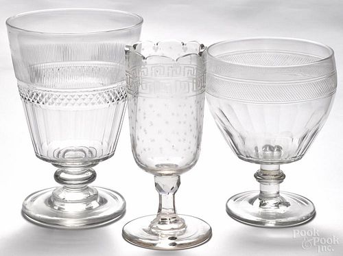 Three molded and cut colorless glass footed vases, 19th c., to include one etched example, 8 1/2'' h.