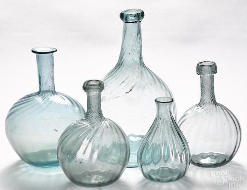 Five blown pattern-molded aquamarine glass bottles, 19th c., tallest - 8 3/4''.
