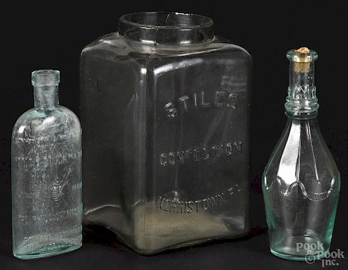 Two pressed glass aquamarine bottles, 19th/20th c., to include one reading ''Dead Stuck''