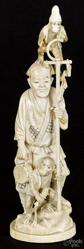 Japanese Meiji period carved ivory figure of a man and two monkeys, 8 1/2'' h.