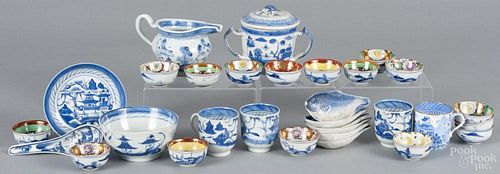 Porcelain tea implements, 19th/20th c., to include a Chinese export Canton cup and saucer, a creamer