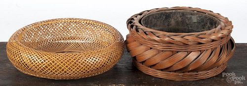 Two Japanese ikebana bamboo baskets, 20th c., one with a metal lining, 3 1/2'' h., 12'' dia.