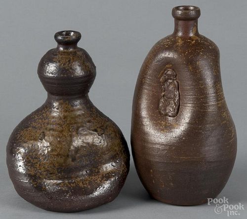 Japanese Bizen-ware sake flask with pinched sides and an applied Ho tai figural decoration, 8 1/2'' h.