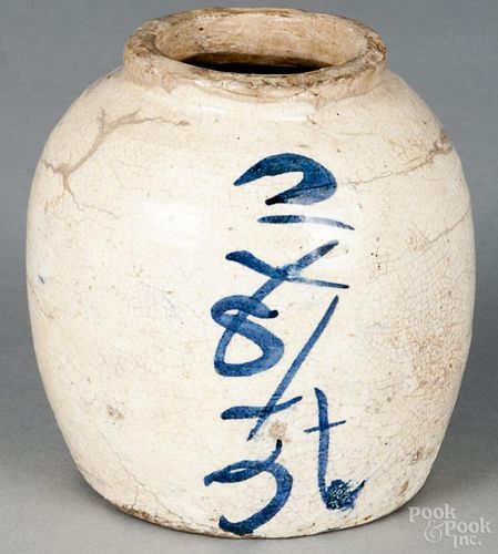 Early Japanese Karatsu-ware tea jar decorated with underglaze cobalt characters, 4 1/4'' h.