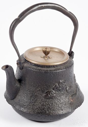 Japanese cast iron teapot, Edo period, tetsubin decorated with a dragon, clouds, and a mountain