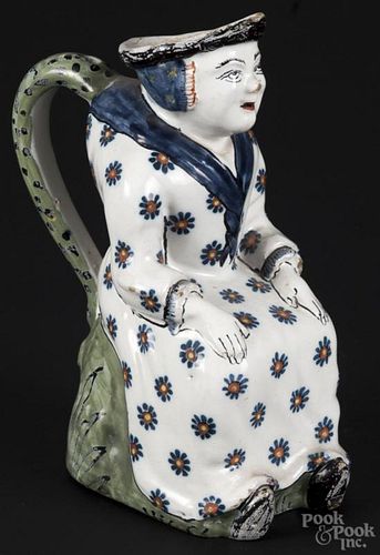 Delft figural pitcher, 18th/19th c., in the form of a hunchback woman, 9'' h.