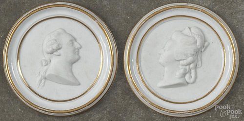 Pair of Sevres biscuit porcelain portrait roundels, featuring relief portraits of Louis XVI