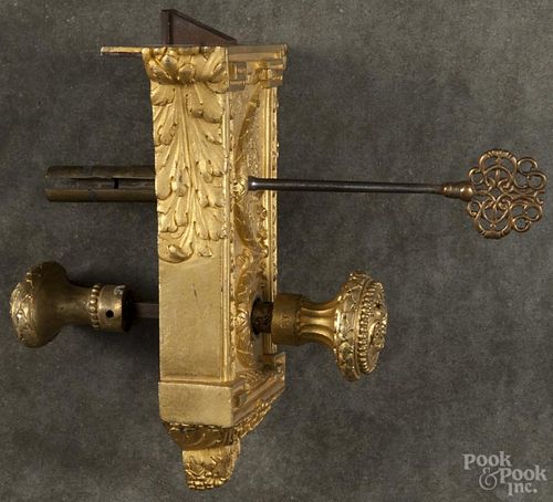 Complete French gilded door lock with knobs and key, 19th c., 5'' h., 7'' w.