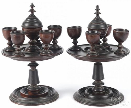 Pair of English treenware stands and cup sets, 19th c., 12 1/4'' h. Provenance: DeHoogh Gallery