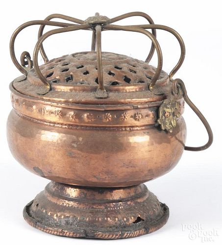 Continental copper and brass hand warmer, 19th c., 8'' h. Provenance: DeHoogh Gallery, Philadelphia.