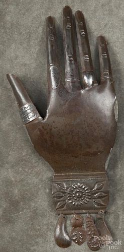 Mexican tin hand Milagros, early 20th c., 10'' l. Provenance: DeHoogh Gallery, Philadelphia.