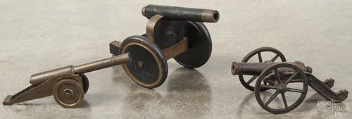 Three miniature cannons, 19th/20th c., to include iron, bronze, and painted wood examples