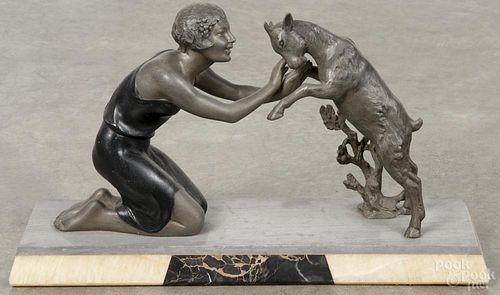 Art Deco metal grouping of a woman and a goat on a stone, all on a marble base, 10 3/4'' h.