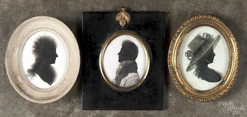 Three Anglo-Irish miniature silhouettes, 18th/19th c., to include one example on plaster, signed