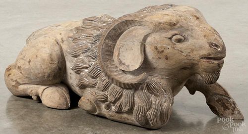 Carved and painted ram in a reclining position, 19th c., retaining small amounts of its original paint