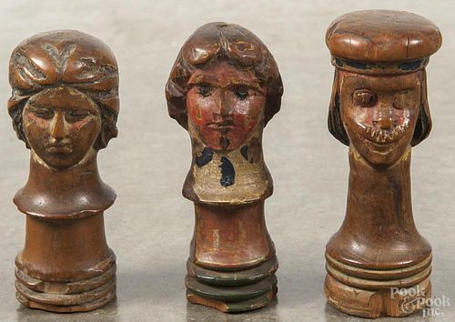 Three Continental carved and painted figural game pieces, 18th c.